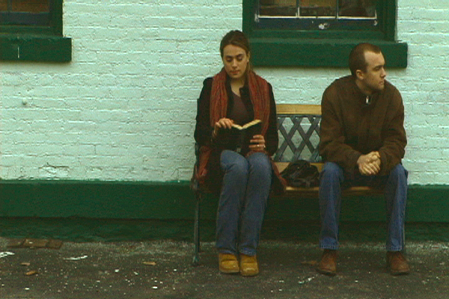 Sylvia and Blake wait at the train station